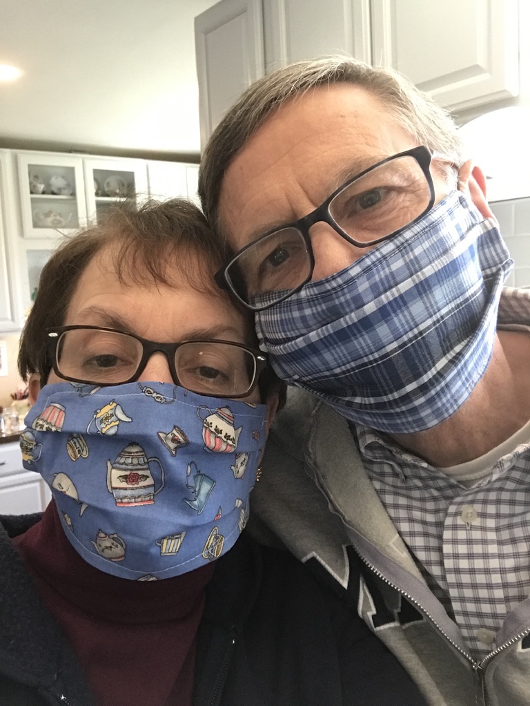 Husband and wife wearing COVID masks